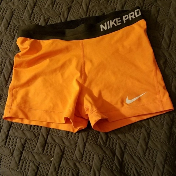 nike pro shorts orange and black